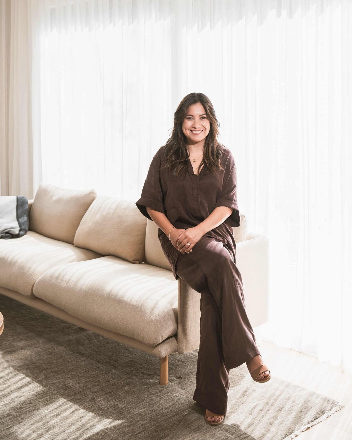 Jaya Ferreira seated in a light-filled room