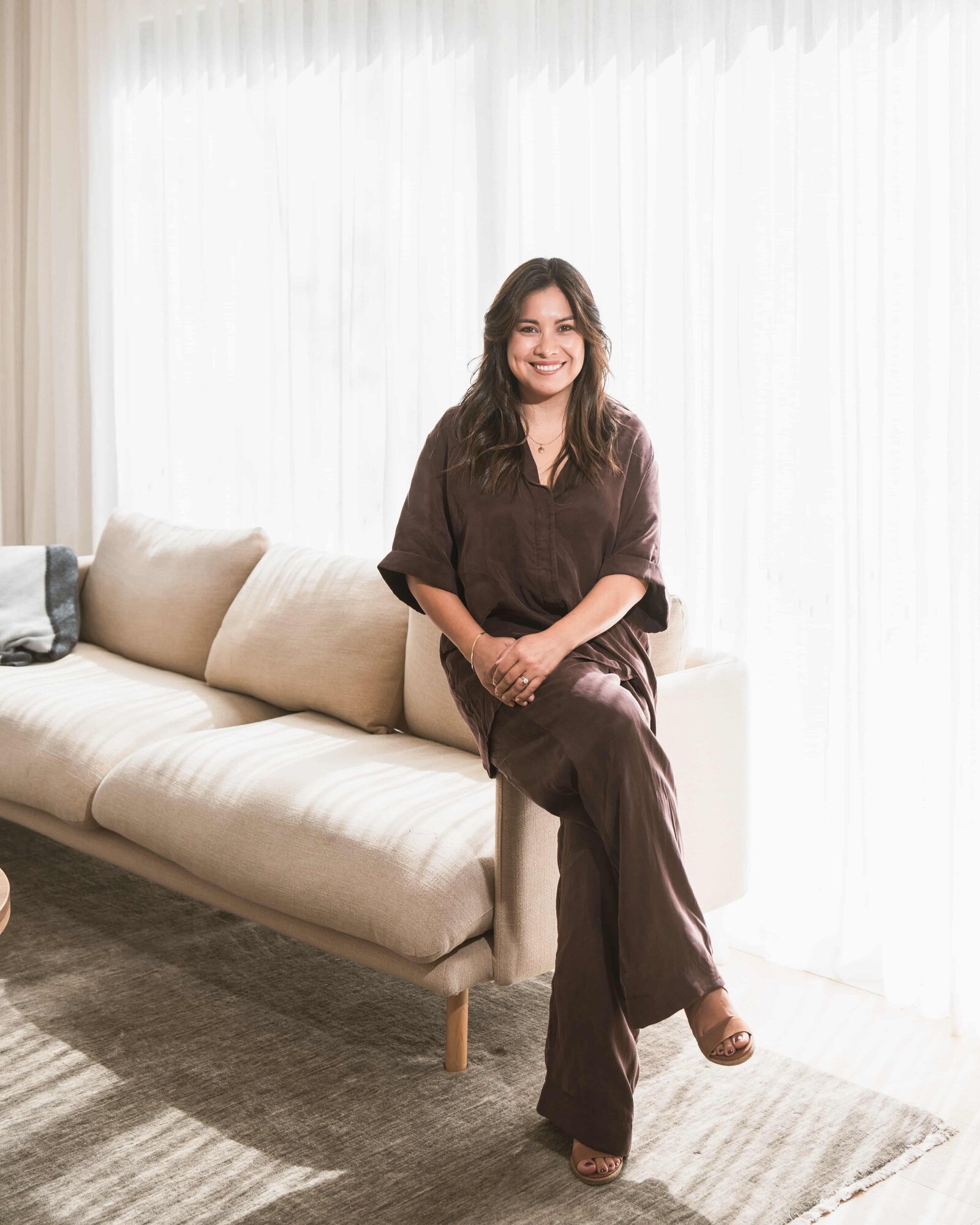 Jaya Ferreira seated in a light-filled room